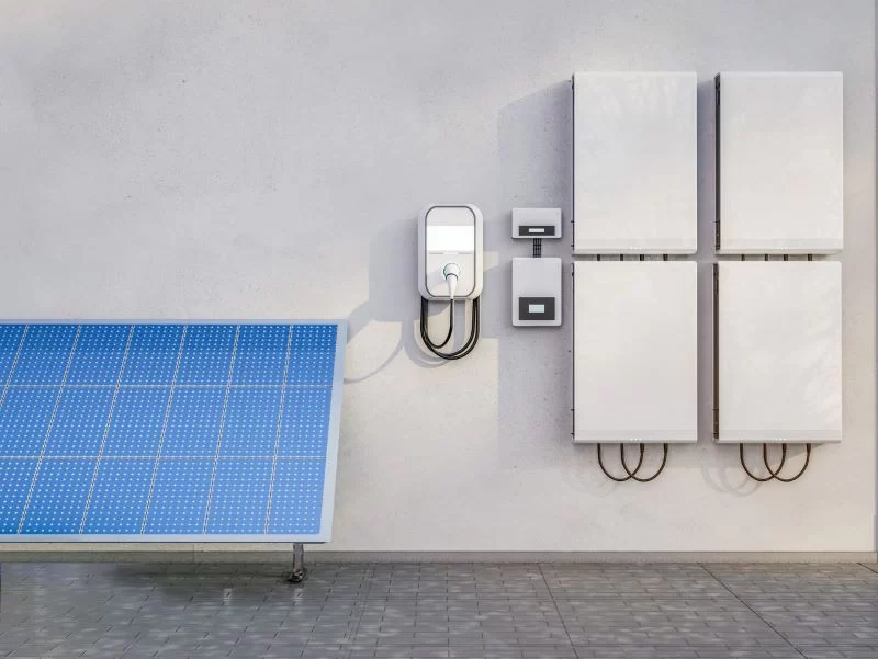 Solar panels on wall with wall-mounted solar panel, hybrid inverter with battery.