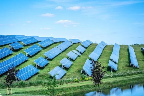 Solar PV system with panels on hillside, harnessing renewable energy from the sun